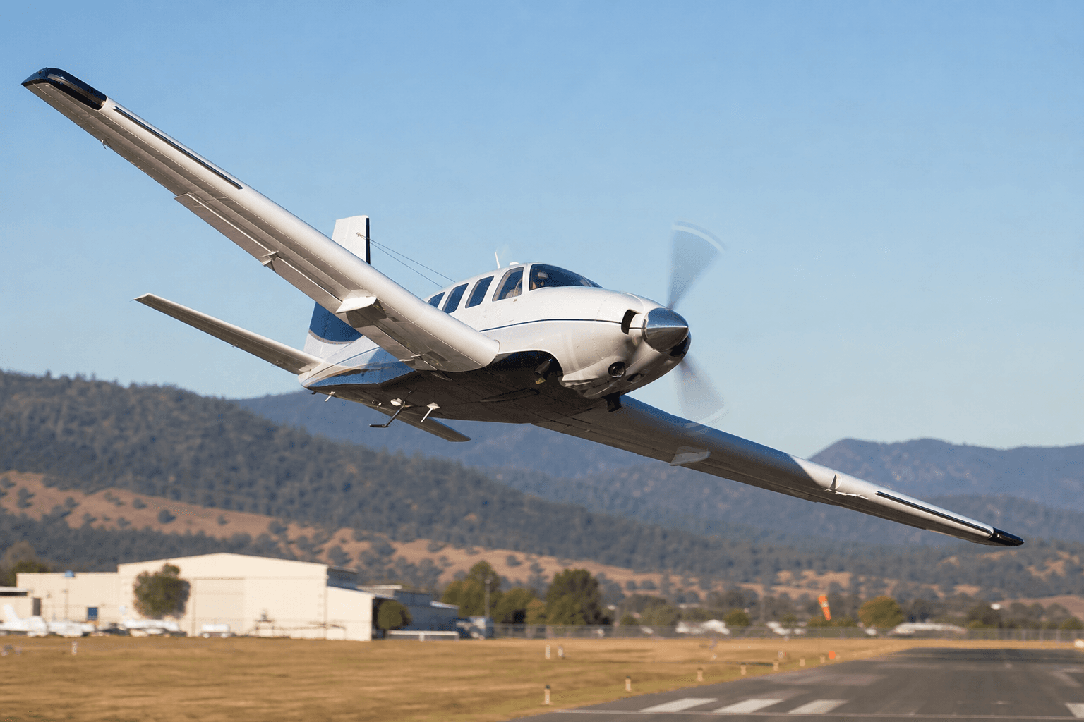 Crashed skydive P-750XL reached perpendicular bank during initial climb