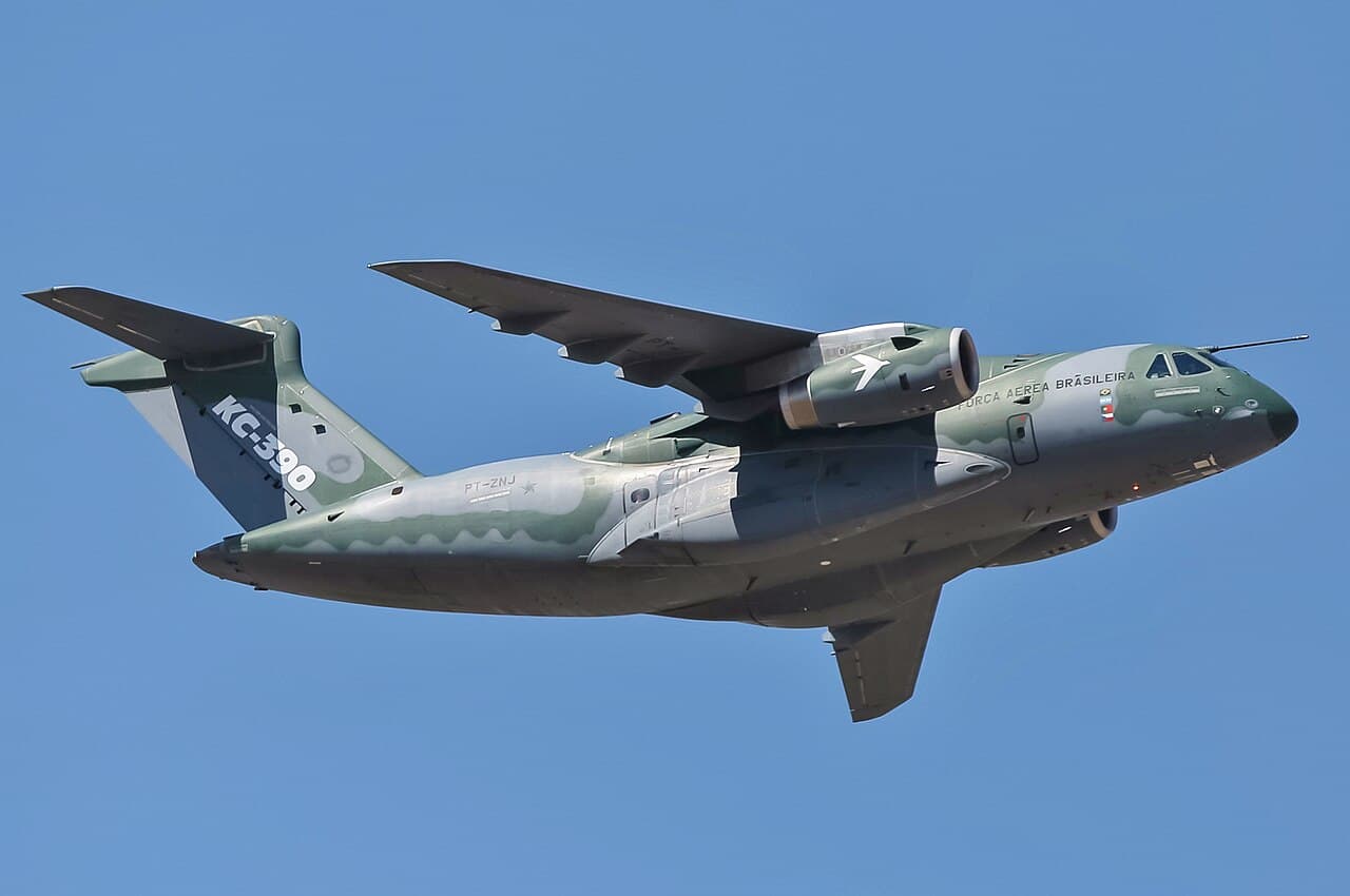Embraer E195-E2 aircraft parked on tarmac during daylight operations