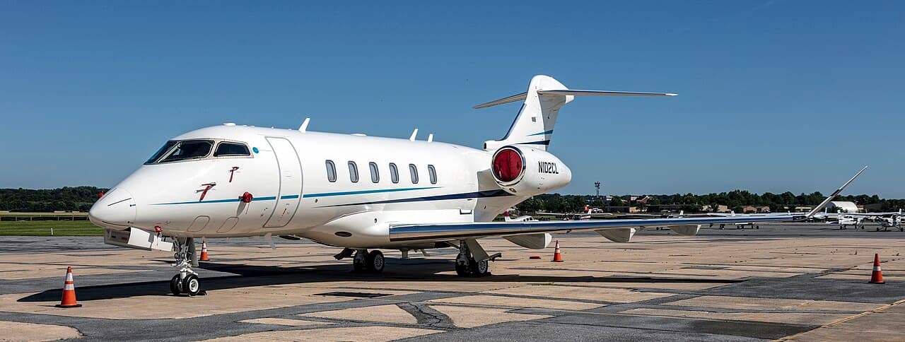 Bombardier Challenger 300 business jet on taxiway at dawn